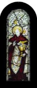 A 19th century stained glass panel, depicting Saint John the Apostle: of arched outline,