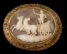 A 19th century oval cameo pendant/brooch: the oval shell cameo approximately 55mm long and