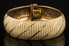 A 9ct gold articulated bracelet: 18cm long, approximately 25gms gross weight.