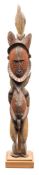 A Papua New Guinea (Maprik area) carved wood and polychrome decorated figure: surmounted by a