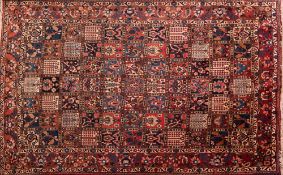 A Bakhtiar garden carpet:, the compartmented field with palmettes,
