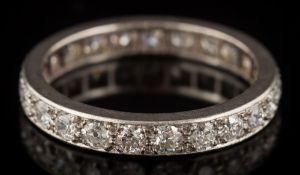 A diamond eternity ring: pave-set with round brilliant-cut diamonds estimated to weigh a total of 1.
