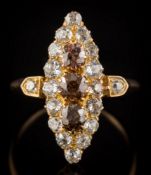 A Victorian cognac coloured diamond and diamond marquise-shaped cluster ring: with three round old,