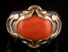 A silver and coral mounted ring: the un-hall marked,