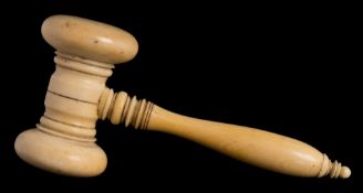 A late 19th/early 20th century ivory gavel: with ring turned head and handle, 12.5cm. long.