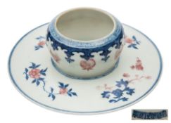 A Chinese copper-red and underglaze blue bowl-stand: of globular form on a shaped dish and splayed