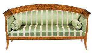 A 19th Century French birch, amboyna wood and ebonised scroll end settee:,
