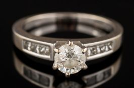 An 18ct white gold and diamond ring: the round, brilliant-cut diamond estimated to weigh 0.