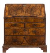 An early 18th Century walnut veneered and cross and feather banded bureau:,