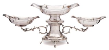 A silver plated twin-branch table centrepiece: the central cartouche-shaped dish on a waisted stem
