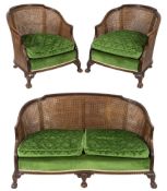 A 1920's carved walnut and beechwood three piece bergere suite:,