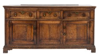 An 18th Century oak rectangular dresser base:, the top with a moulded edge,