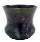 A Moorcroft pottery jardiniere: tube lined in the Iris pattern in shades of blue, green,
