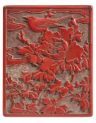 A Chinese cinnabar lacquer rectangular box and cover: the lid decorated with a bird perched amongst