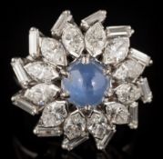 A star sapphire and diamond circular cluster ring: with central round star sapphire approximately 6.