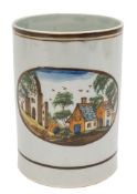 A Pratt pearlware cylindrical mug: painted with an oval panel of cottages and ruins in a landscape,