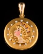 An early 20th century enamelled gold, ruby,