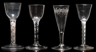 A mixed group of English glasses: comprising an example with rounded funnel bowl set on a double