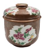 A Chinese famille rose 'batavian' ware jar and cover: decorated with leaf shaped panels of peonies,
