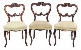 A set of six Victorian carved rosewood dining chairs:,