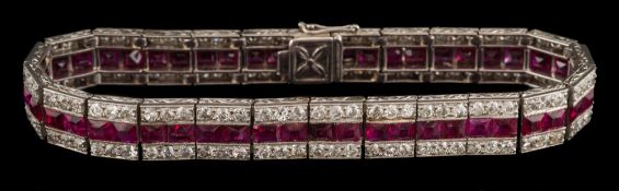 An early 20th century ruby and diamond line bracelet: with central row of calibre-cut rubies