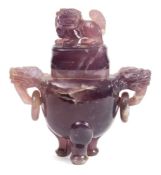 A Chinese amethyst quartz tripod censer and cover: with lion dog finial and similar loose ring