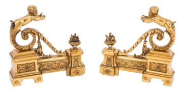 A pair of French gilt brass chenets:,