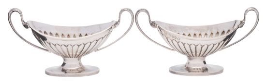 A pair of Victorian silver pedestal salts, maker Edward Hutton, London,