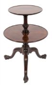 A mid 18th Century carved mahogany circular two tier graduated dumb waiter:,