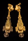 A pair of 19th century gold pendant drop earrings: each articulated pear-shaped drop with foliate
