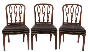 A set of five George III mahogany dining chairs in the Hepplewhite taste:,