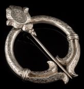 A Victorian silver penannular brooch: engraved overall with floral and foliate scroll motifs,