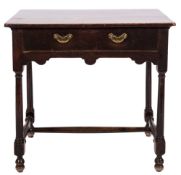 An 18th century oak and fruitwood rectangular side table: with an overhanging top,