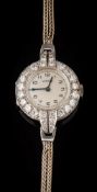 A lady's diamond mounted 'Vertex' cocktail wristwatch: the circular dial with Arabic numerals,