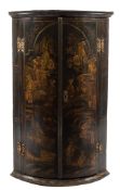 An 18th Century black lacquer and chinoiserie bow-fronted hanging corner cupboard:,