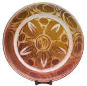 Edgar Campden for Aldermaston Pottery a pottery charger: of circular form decorated with ruby