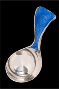 * An Elizabeth II silver and enamel caddy spoon, maker Jenny Edge, London,
