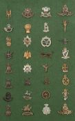 A collection of WWI & WWII British Army cap badges:, including Special Air Service,