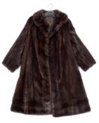 A full length mink fur coat by Maxwell Croft, London:.