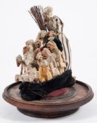 A Victorian Macabre Snap Dragon seed pod headed doll group 'The Old Lady who Lived in a Shoe':,