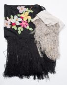 A Victorian black silk shawl with applied floral decoration and tassel fringe:,