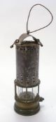 A late 19th/early 20th century miner's lamp:, unsigned, 25cm high.