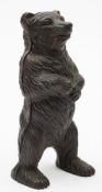 An American cast iron bear money box:, 15.5cm tall.
