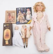 A large linen headed doll together with a Continental porcelain head doll,