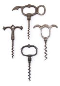 A group of four steel and iron finger pull corkscrews.