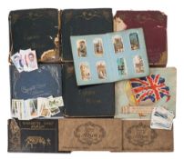An accumulation of sets and part sets of cigarette and trade cards in albums and loose:,