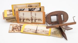 A Brewster pattern stereoscope viewer and a collection of stereoscope cards,