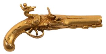 A miniature 9ct gold model of a flintlock pistol, London 1969:, 7.7grams, 4cm long.