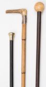 An early 20th century silver mounted antler handled walking cane:,