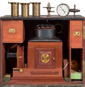 A late 19th century mahogany and brass magic lantern:, unsigned, with Russian lacquer chimney,